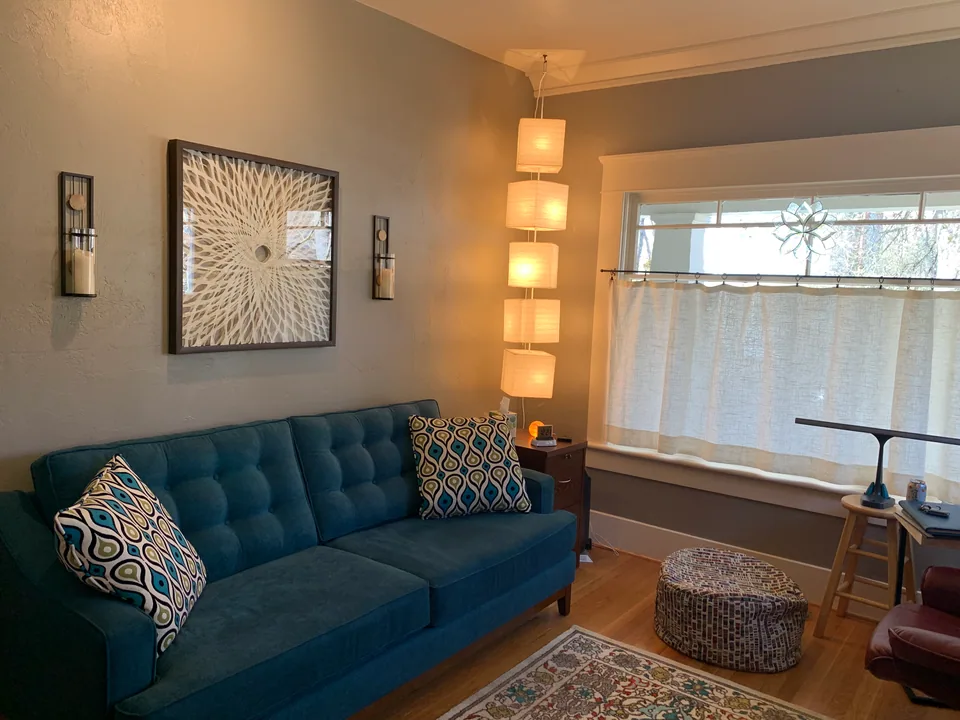 Annelise Heitman's counseling office with a blue sofa
