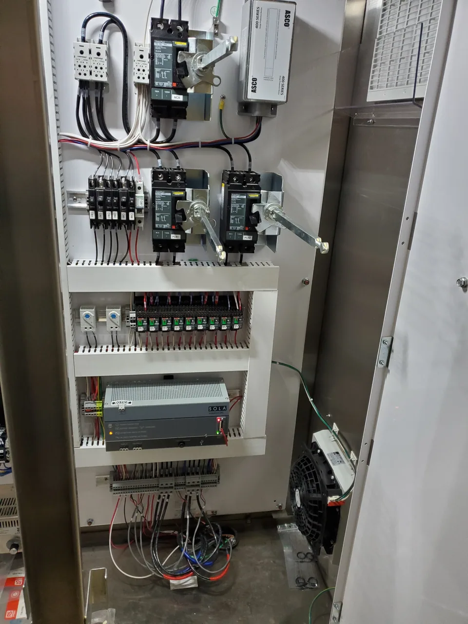 Control panel with breakers and wiring installed by Johnsen Electric
